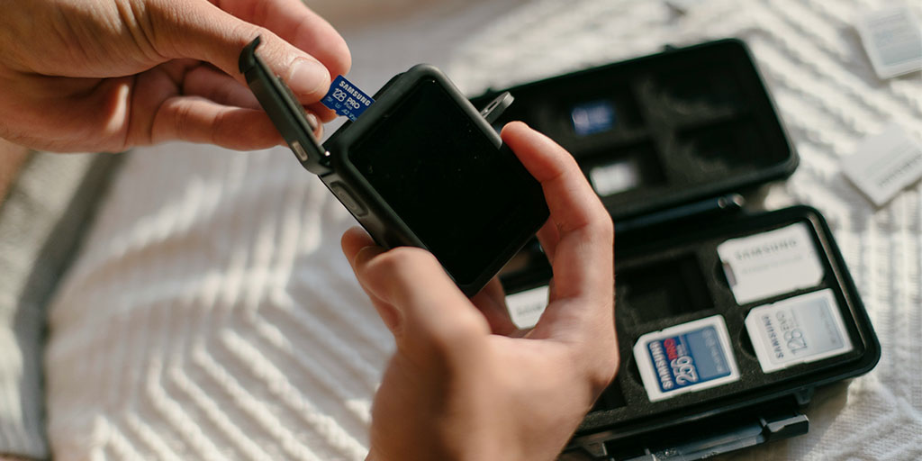 Samsung SD card being inserted in the best action camera of 2025